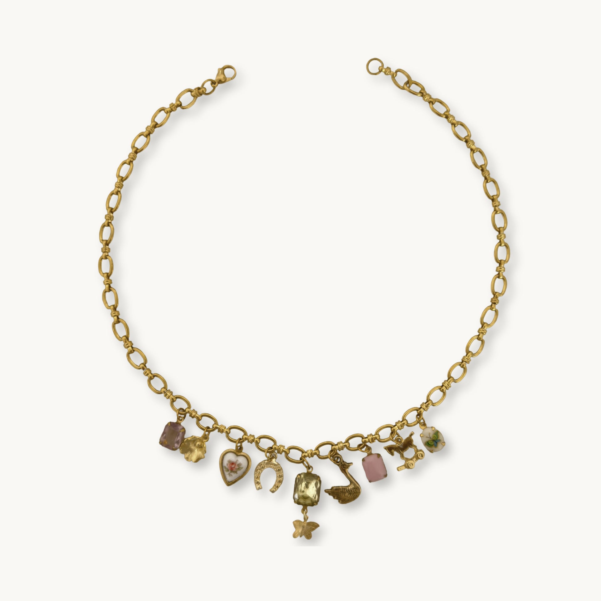 Althea Necklace - 22K gold-plated Amelie chain with an amethyst stone, floral charms, and ceramic details, a vintage-inspired piece.