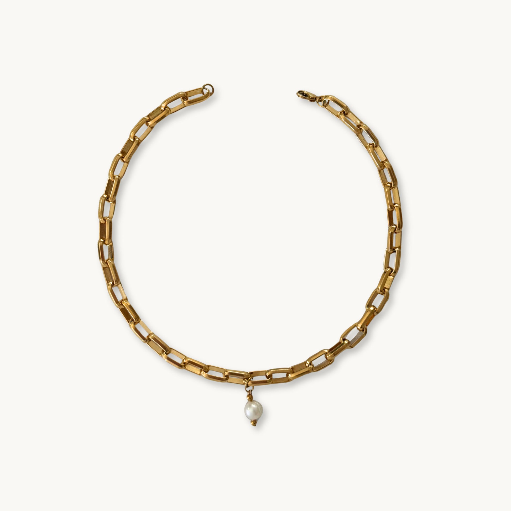 Flat-lay of the Beanca Necklace against a neutral background for a minimalist look.