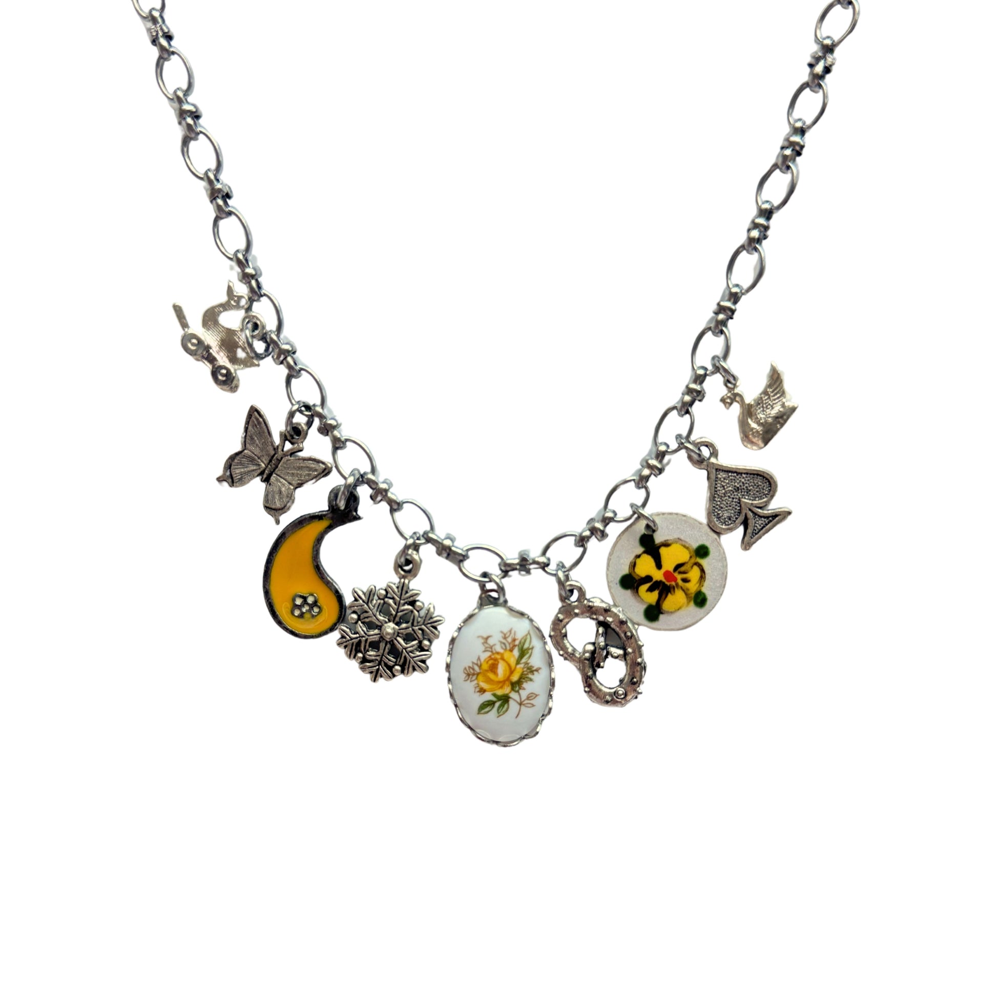 Close-up of yellow rose ceramic and pansy guilloche