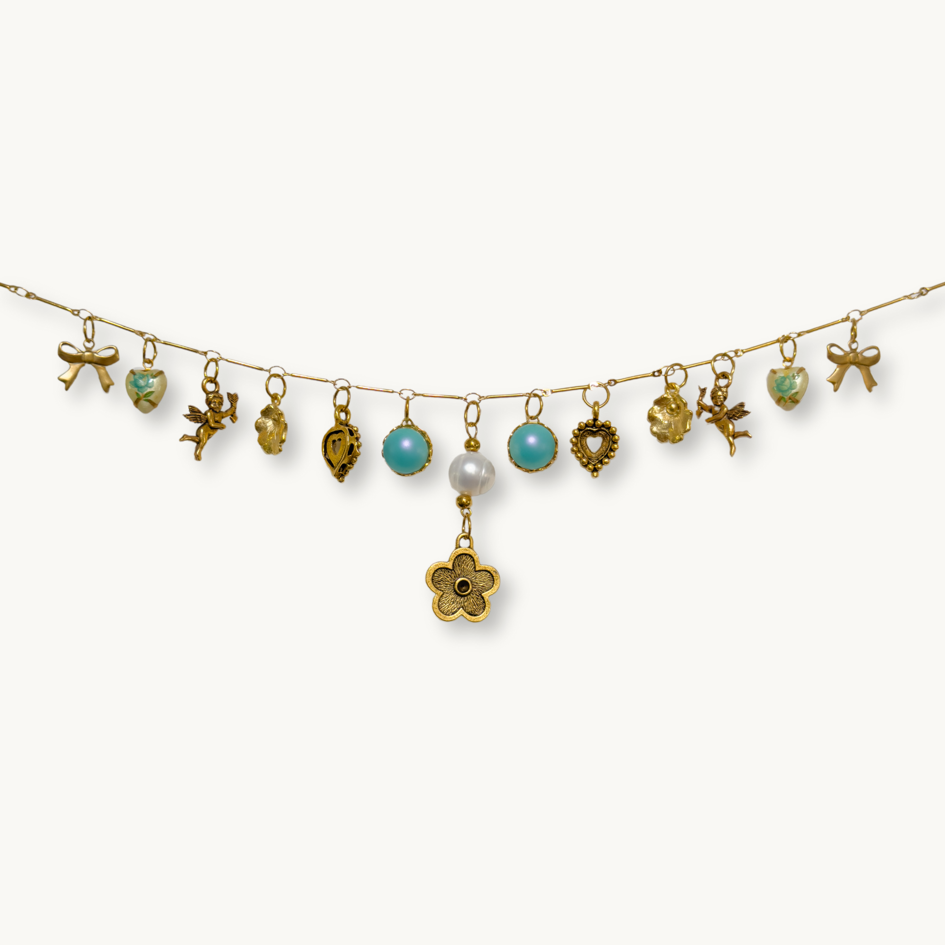 Close-up of the Sabrina Necklace showcasing its detailed mirrored charms and floral pearl drop.