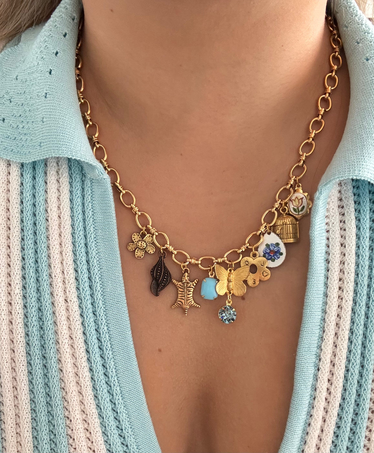 Gold and silver charm necklaces with dainty and bold pendants.