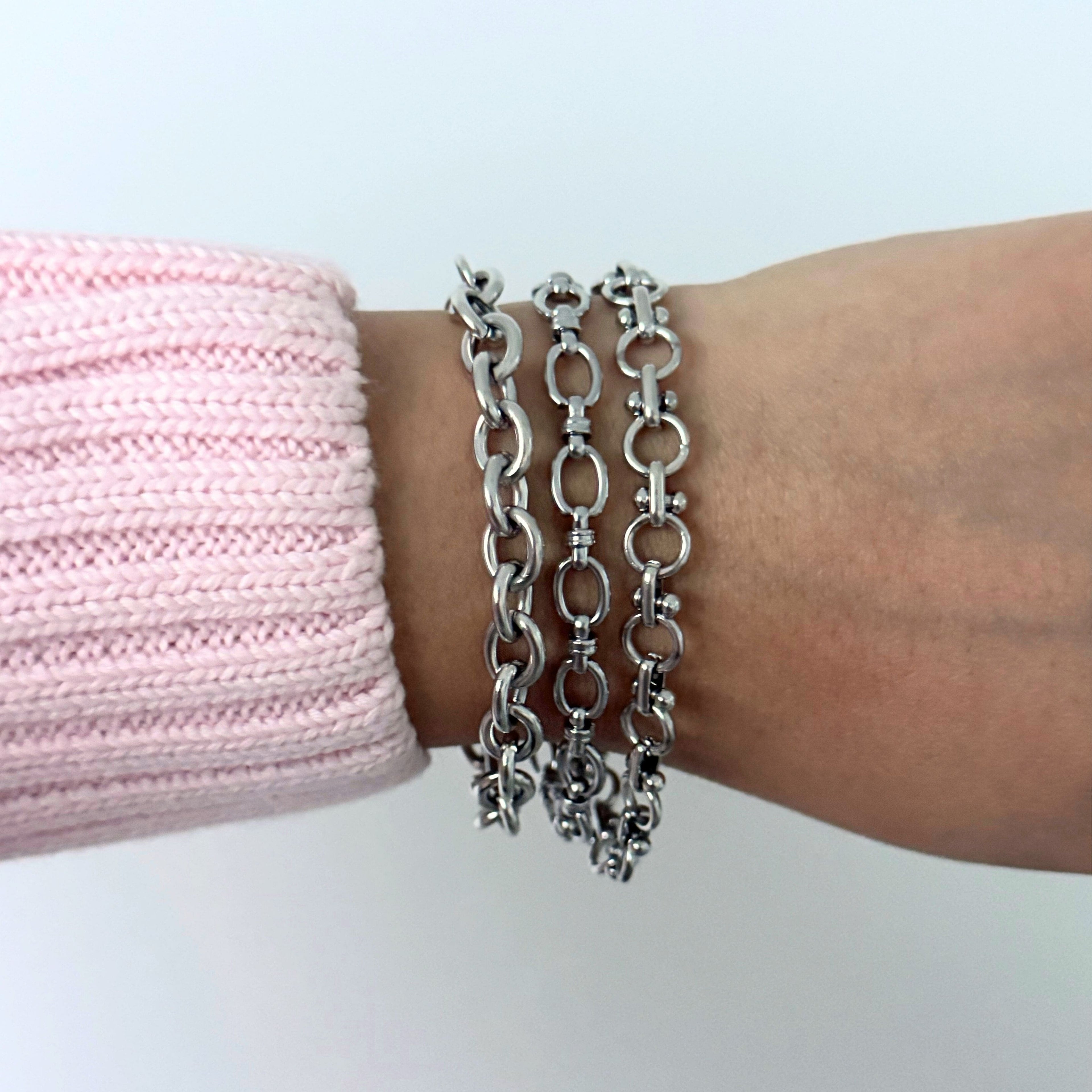 Close-up of silver bracelet charms 