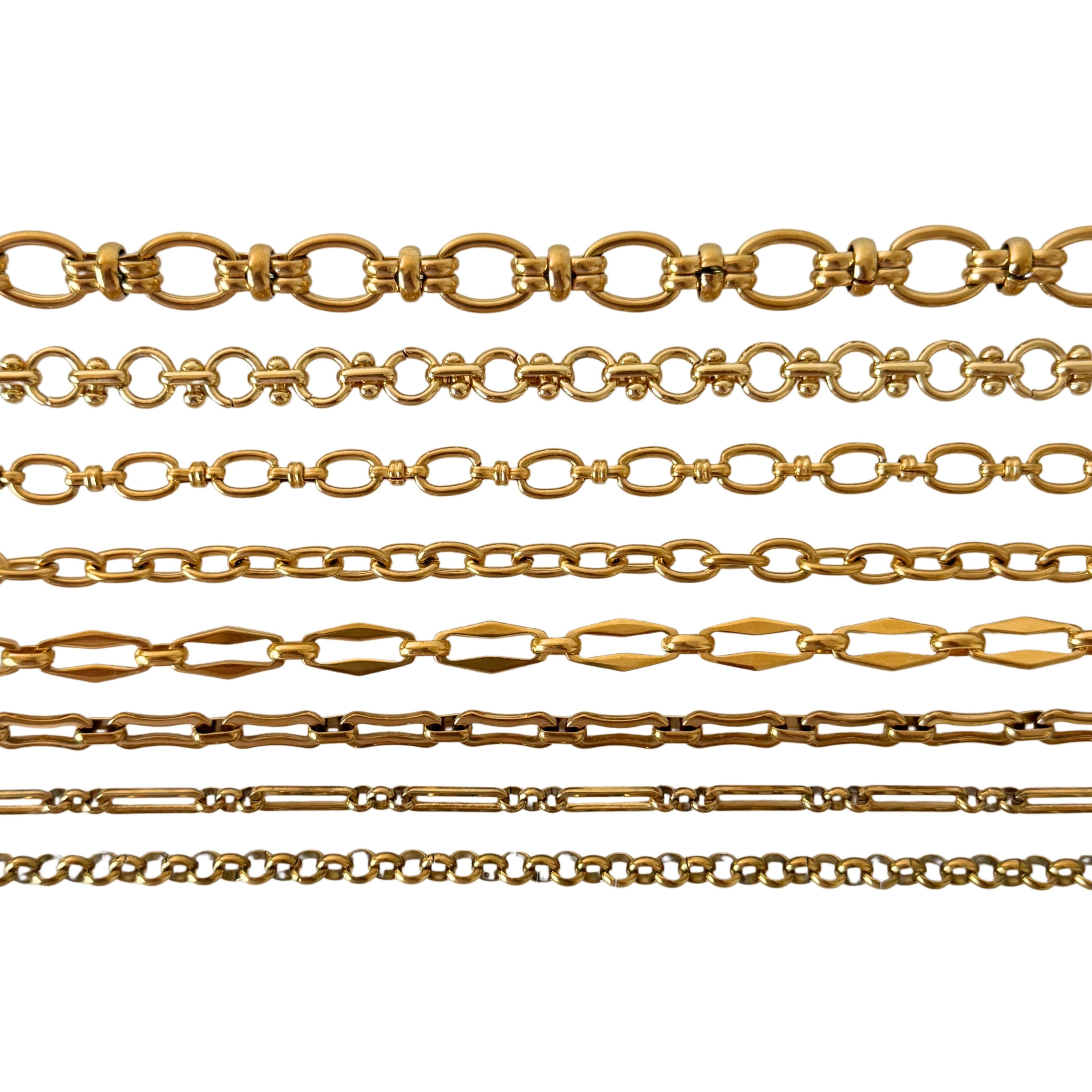 Close-up of gold necklace charms 