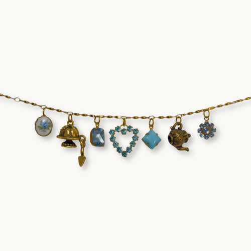 Flat-lay of the Ada Necklace against a neutral background, emphasizing its fine details.