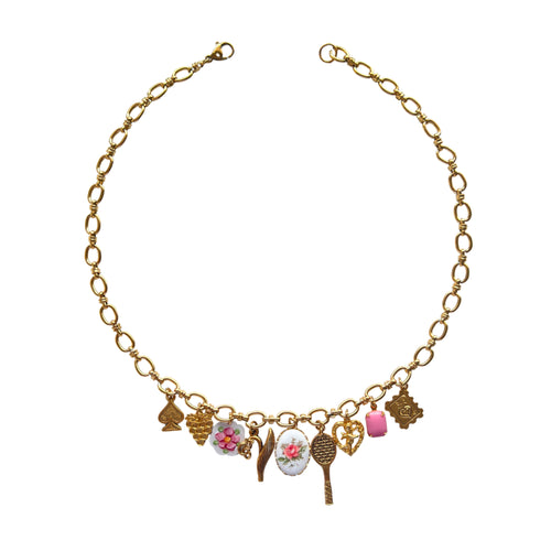 Agnes Necklace flatlay with playful and vintage charms
