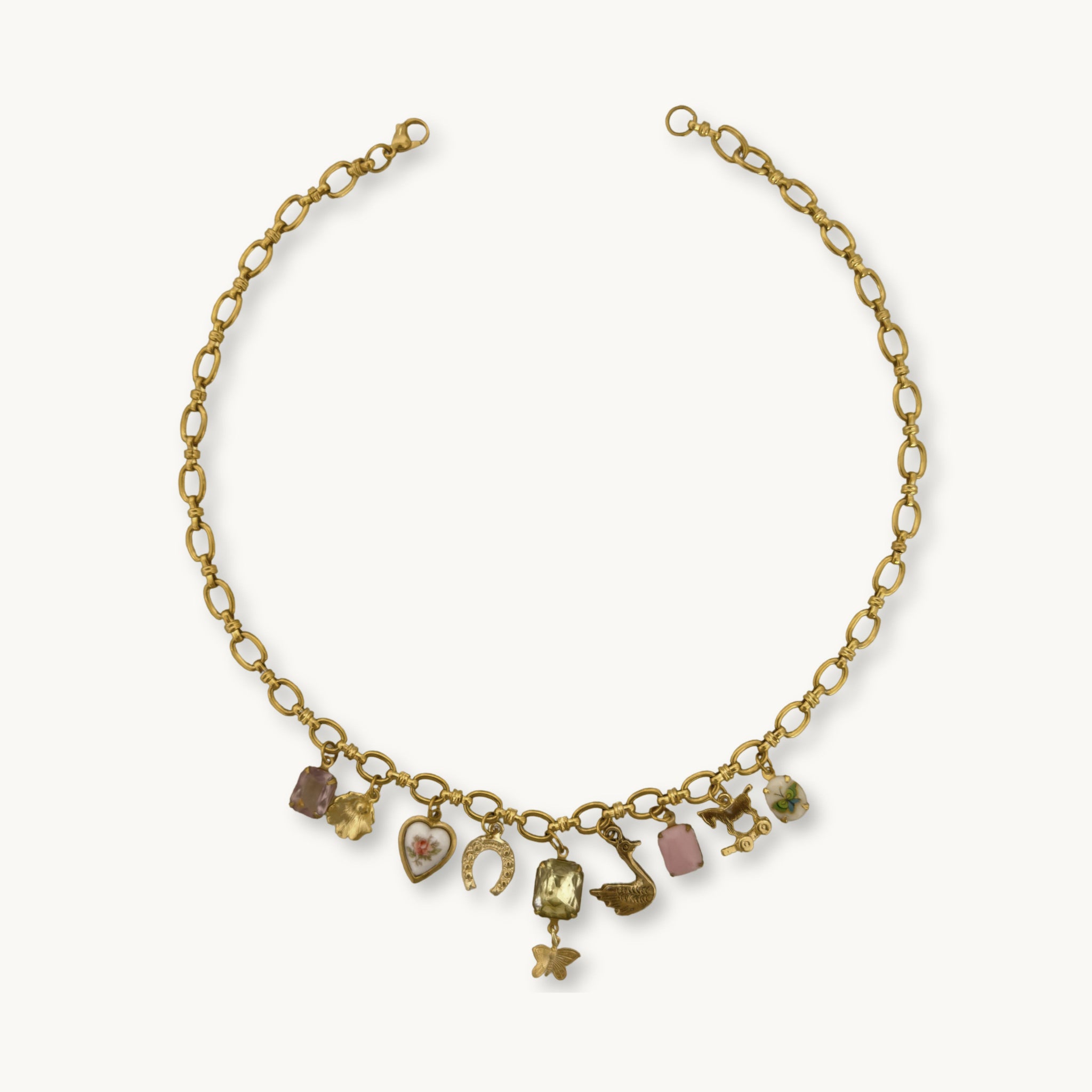Althea Necklace - 22K gold-plated Amelie chain with an amethyst stone, floral charms, and ceramic details, a vintage-inspired piece.