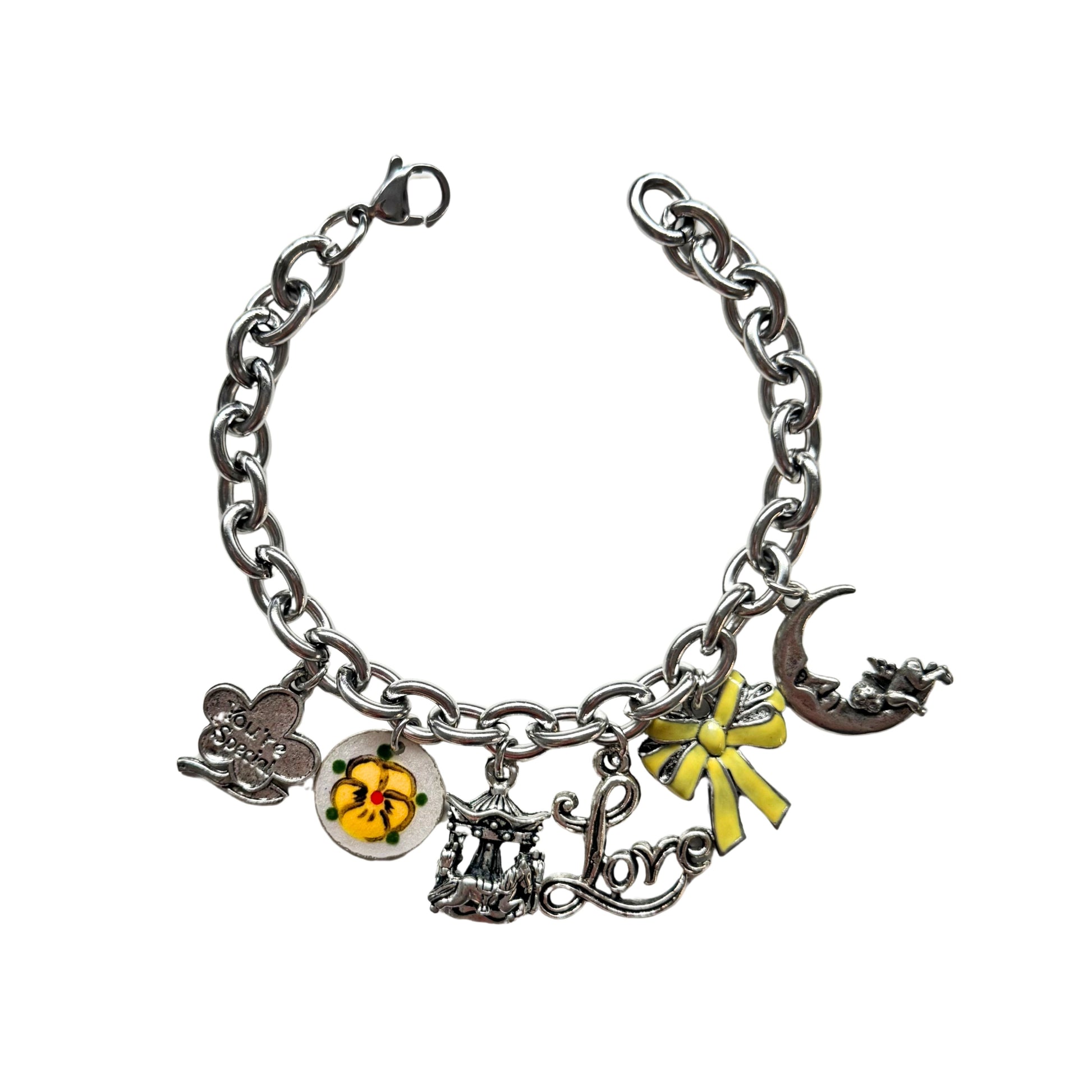 Close-up of hand-enameled yellow bow and pansy guilloche
