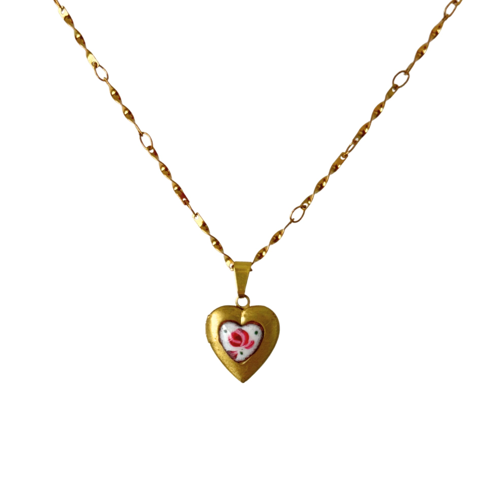 Close-up of hand-painted rose guilloche charm on twist chain