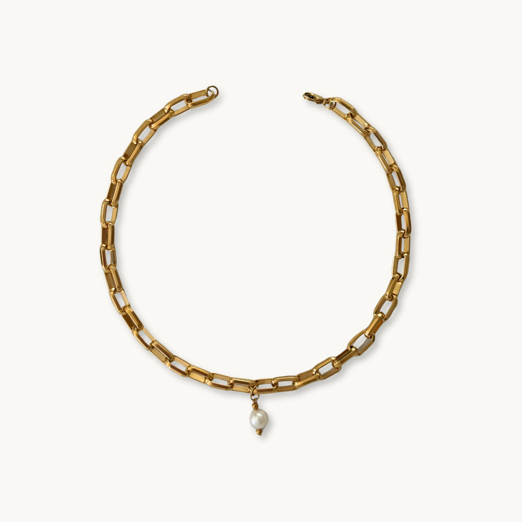 Flat-lay of the Beanca Necklace against a neutral background for a minimalist look.
