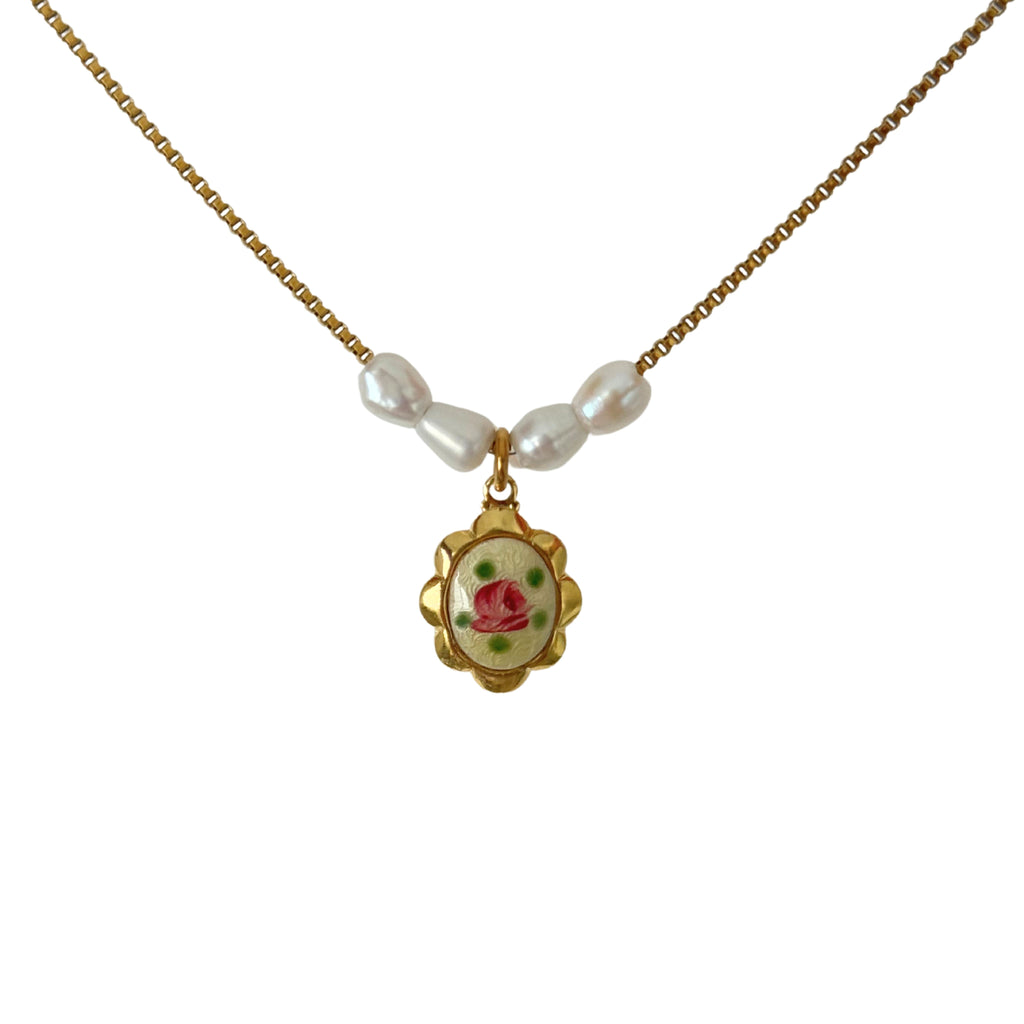 Close-up of freshwater pearls with hand-painted guilloche settings