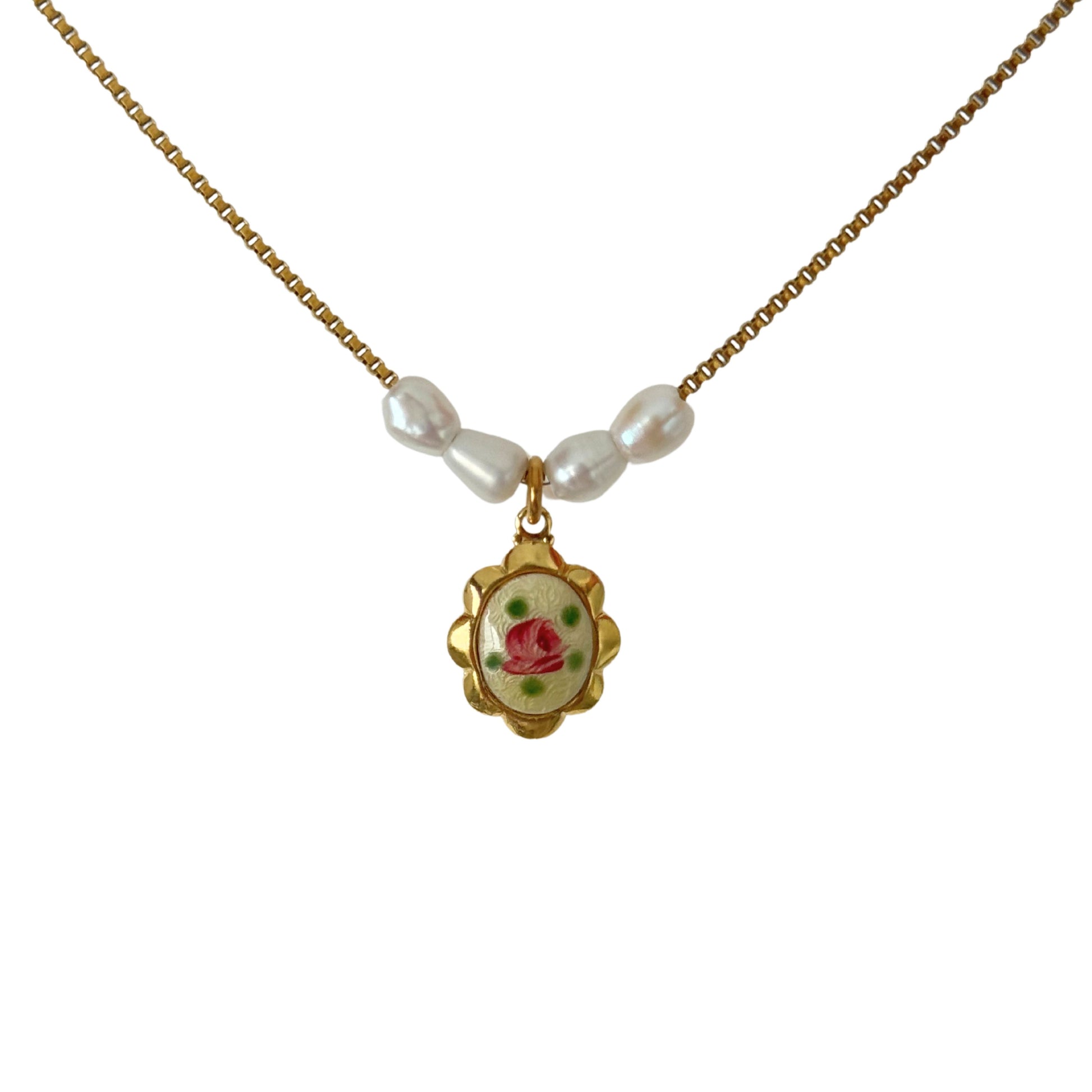 Close-up of freshwater pearls with hand-painted guilloche settings