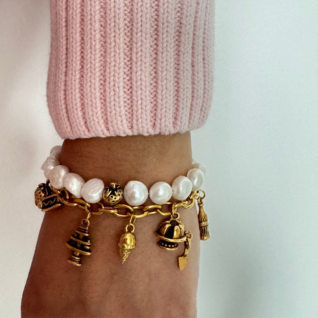 Gold-plated charm bracelet featuring cupcake, doughnut box, hotdog, and fruit basket