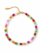 A colorful beaded necklace featuring alternating translucent square beads in pink, light blue, green, and orange, separated by small gold spacer beads and connected by a gold-tone chain clasp.