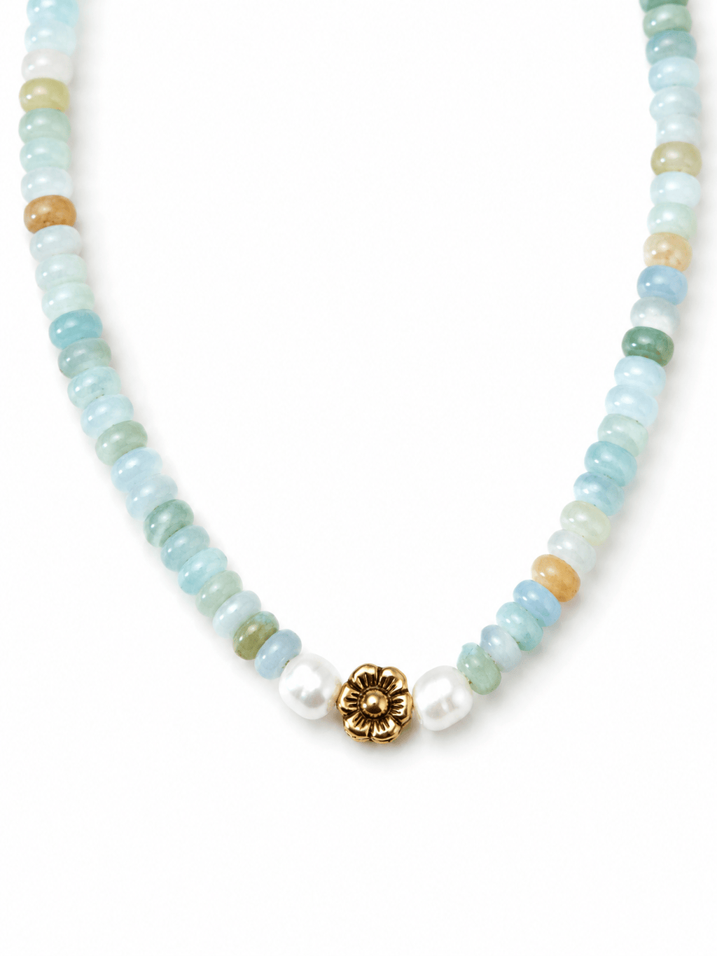 A beaded necklace featuring light blue, green, and tan round gemstone beads, accented with white pearls and a central gold-tone flower charm, shown on a plain white background.