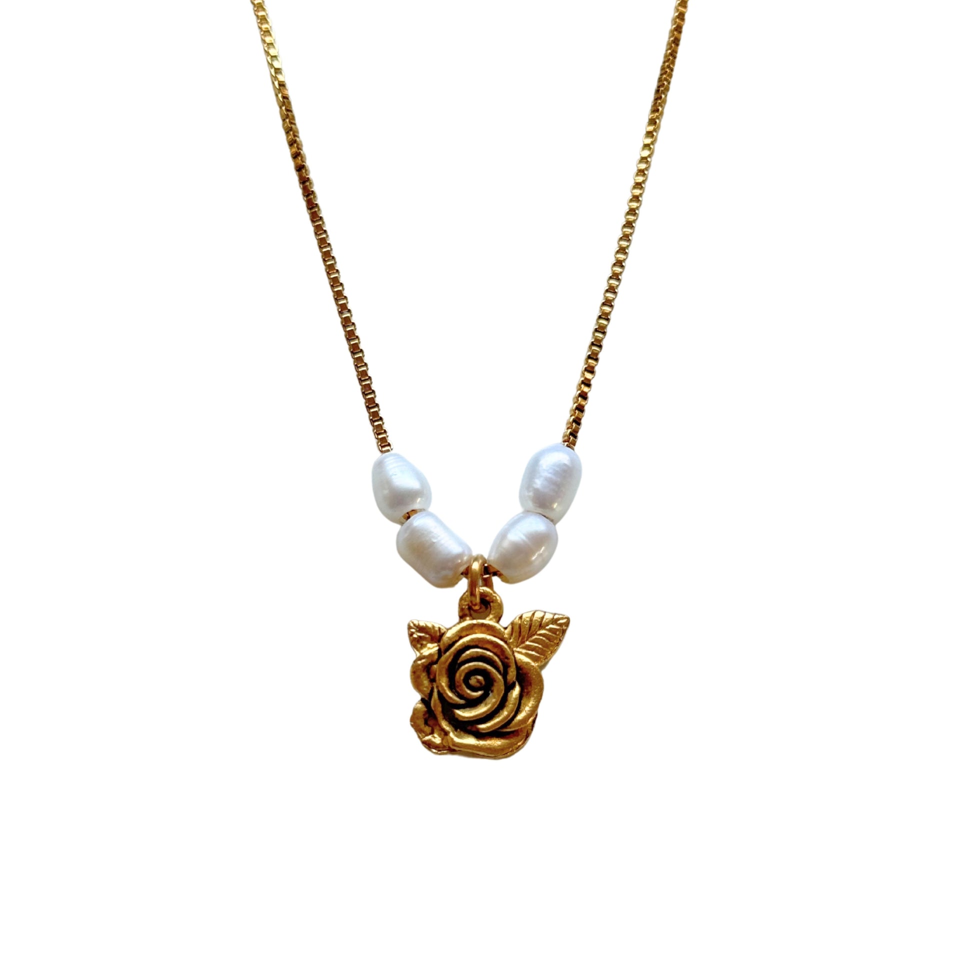 Close-up of shabby English rose pendant and freshwater pearls