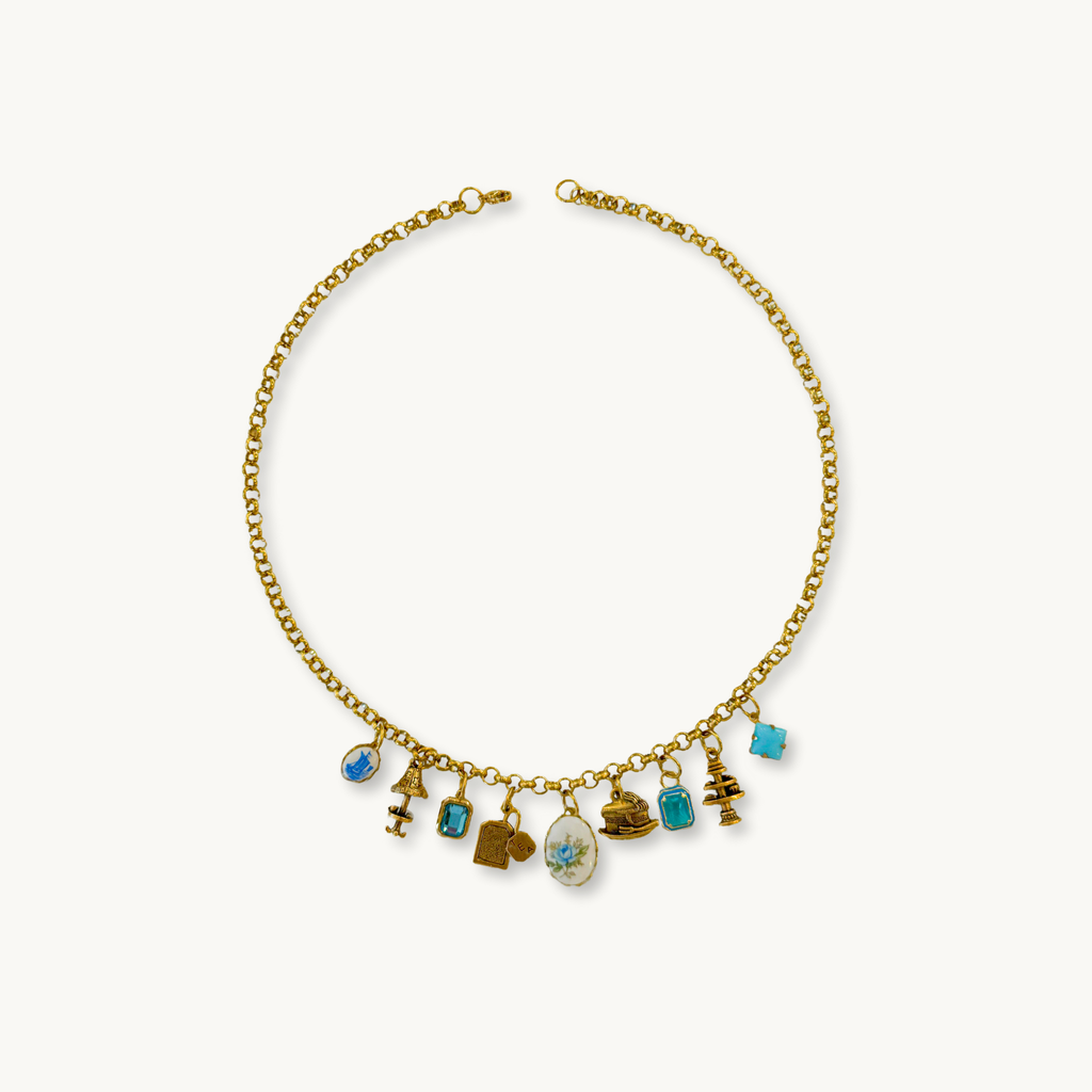 Demelza Necklace featuring an Elodie medium chain with a vintage blue rose oval pendant and 8 handpicked charms.