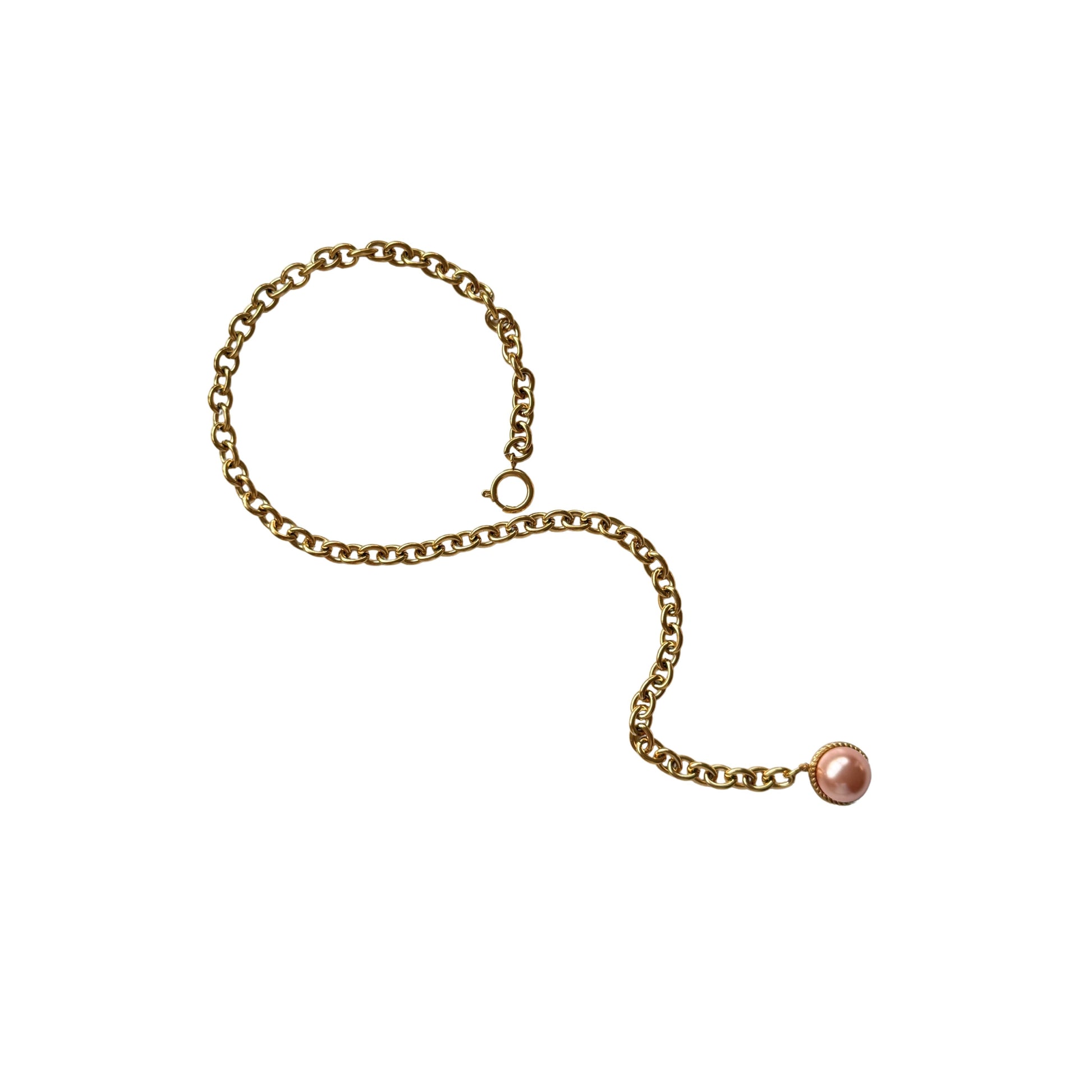 Esmeralda Necklace flatlay with neutral-toned background