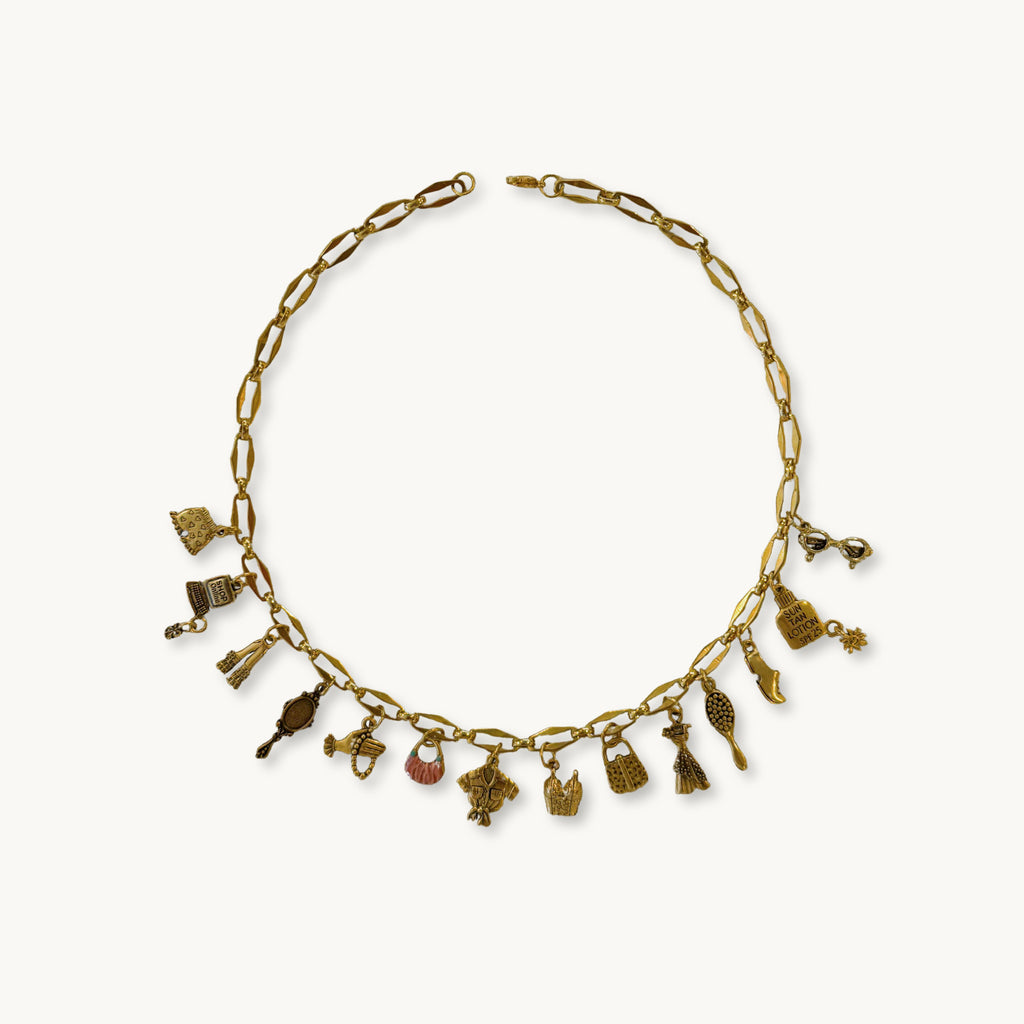 Ethel Necklace featuring a Sophia medium chain with 14 playful, girly charms.