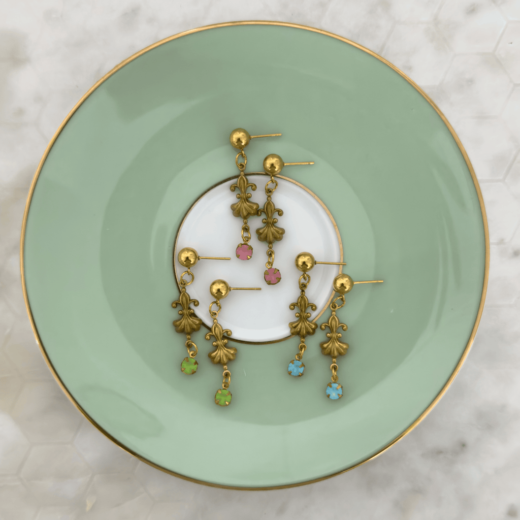 Flat lay of Felise Earrings in green, pink, and blue variations, showing their unique color options.