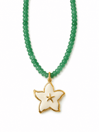 A green beaded necklace with a gold and white starfish pendant on a clean white background.