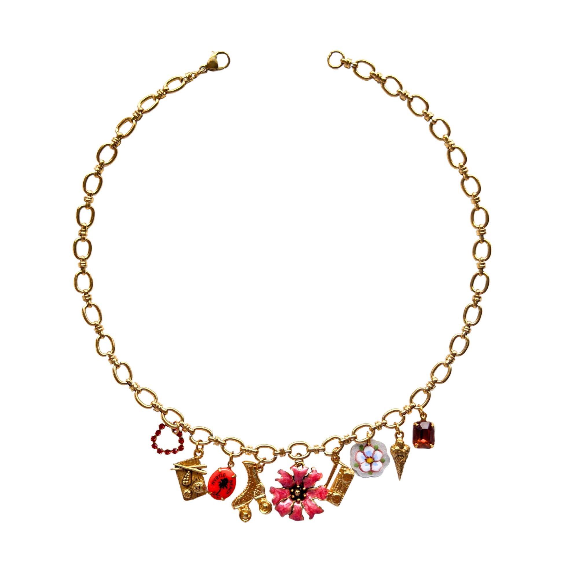 Gilian Necklace flatlay with fun and retro charms