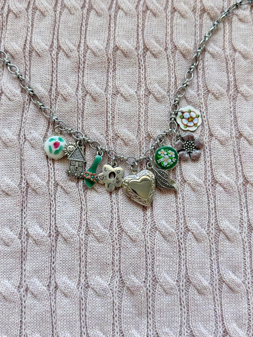 Antique-style white gold necklace with storybook charms