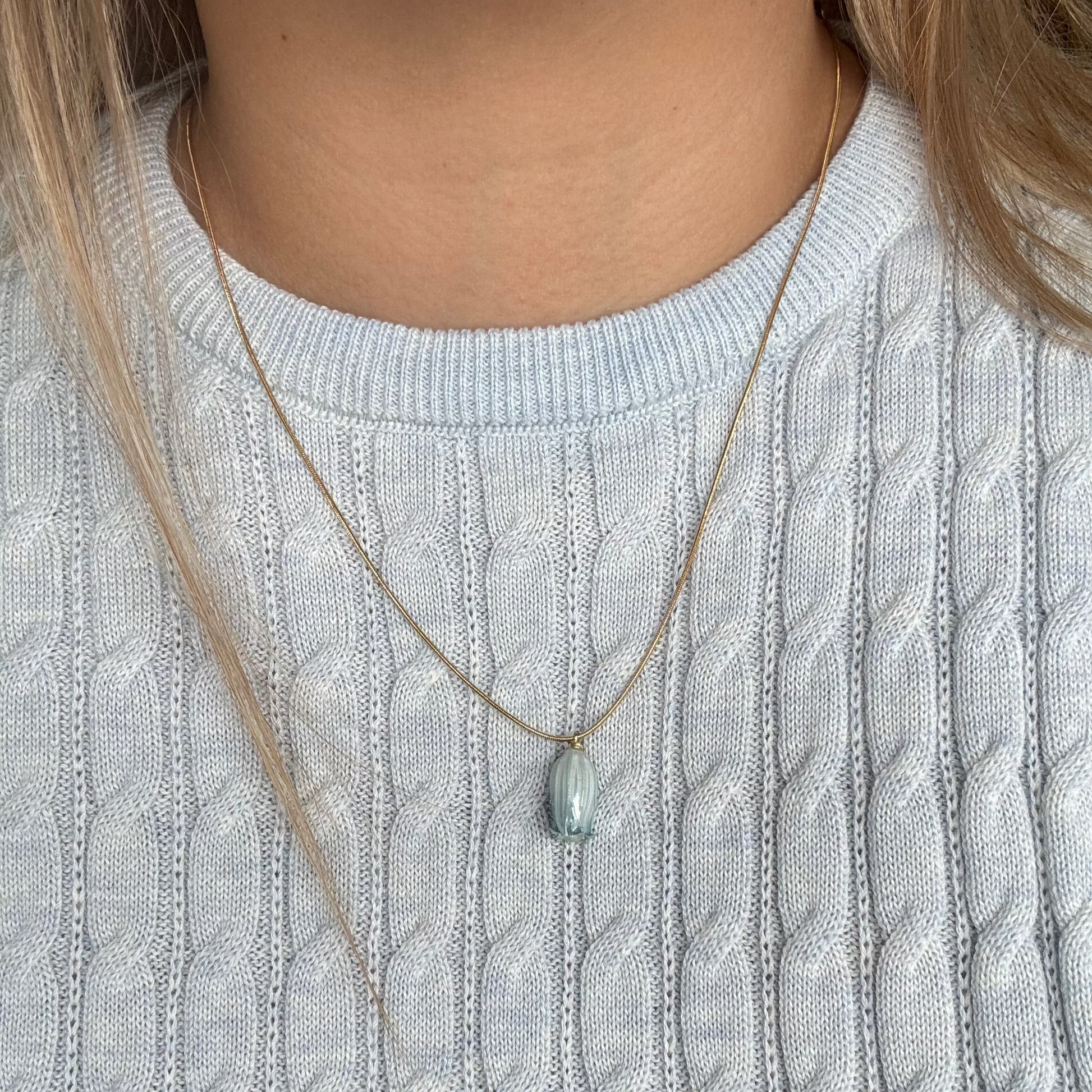 Model wearing the Isla Necklace in blue
