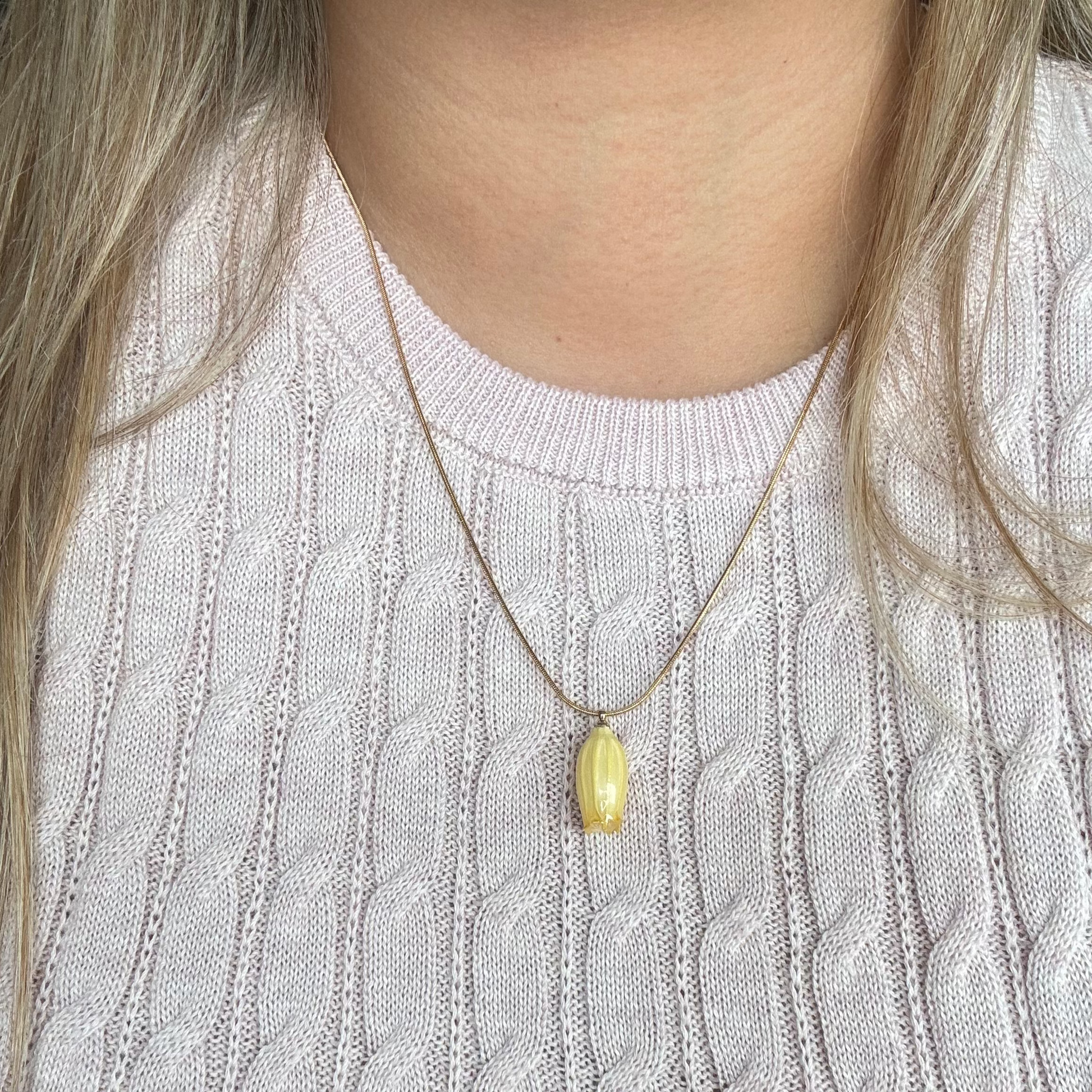 Model wearing the Isla Necklace in yellow
