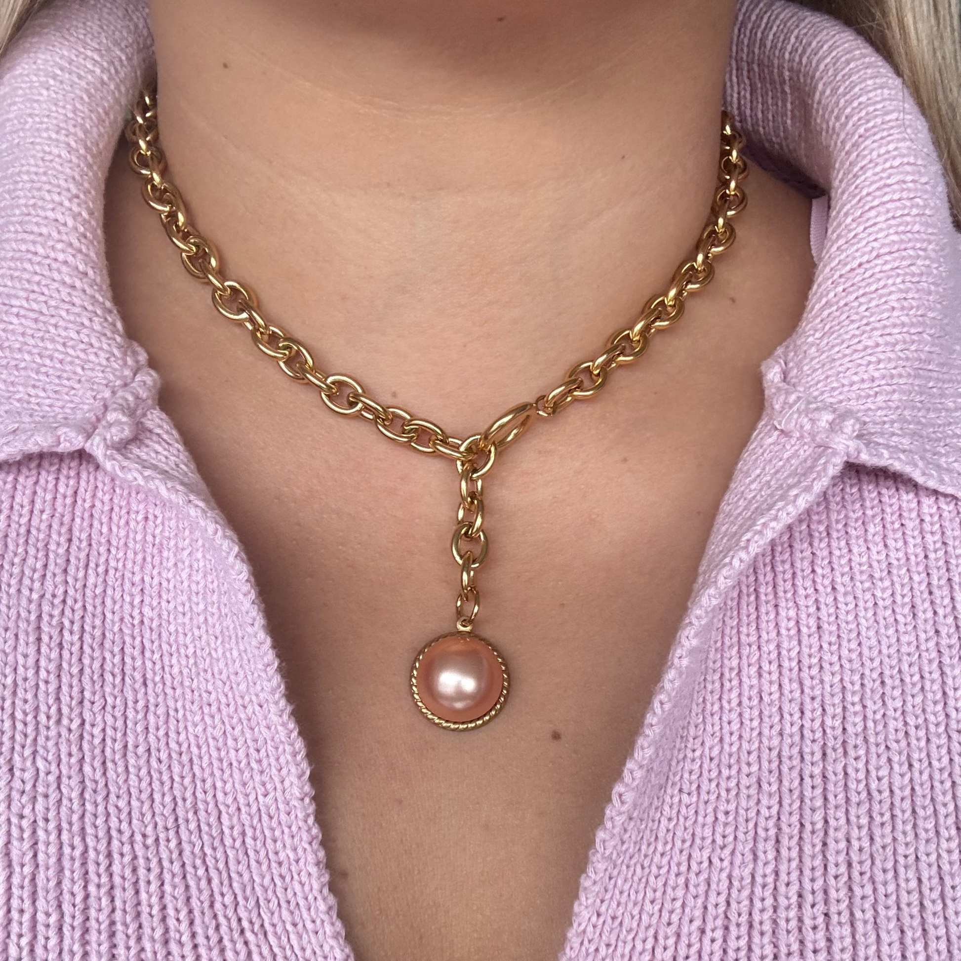 Model wearing the Esmeralda Necklace styled in a layered look
