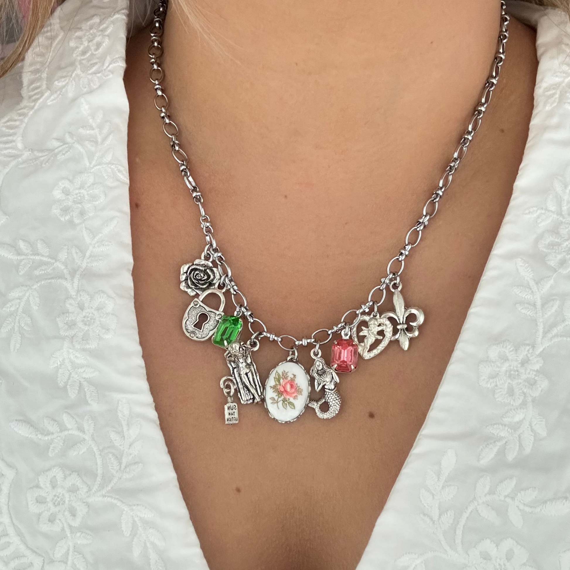 Model wearing the Tatiana Necklace layered with neutral blouse