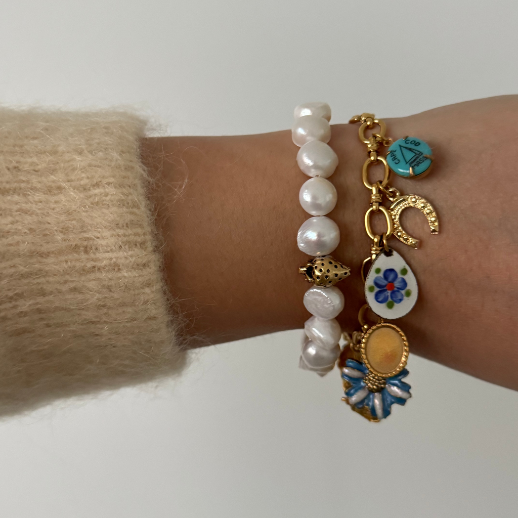 Model wearing Kyra Bracelet with pearl bracelet