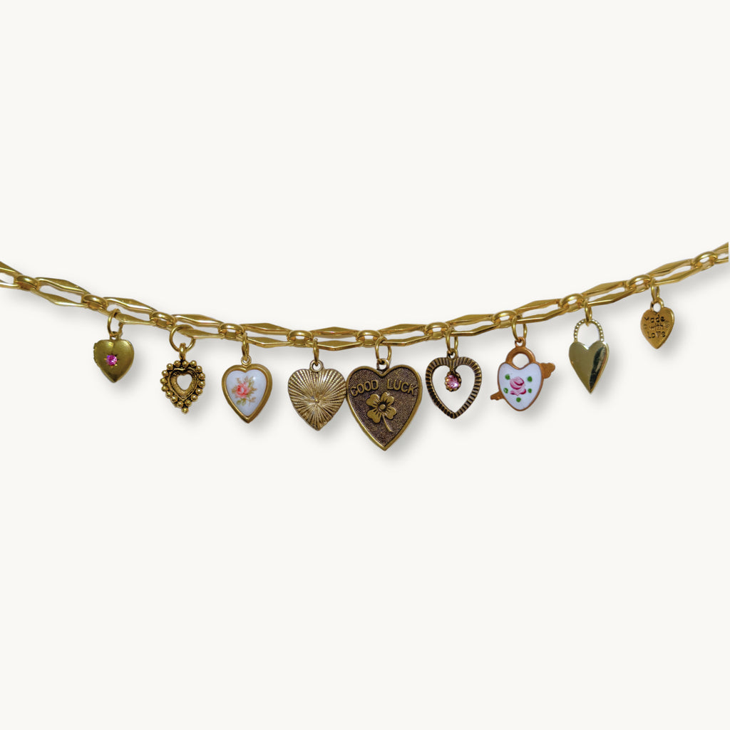 Close-up of the Isabella Necklace showcasing the antiqued heart locket with pink Swarovski crystals.