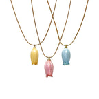 Three color options of Isla Necklace with natural floral detail
