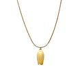 Isla Necklace flatlay with yellow flower charm