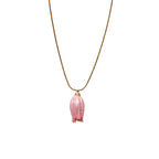 Isla Necklace flatlay with pink flower charm