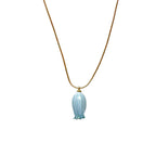 Isla Necklace flatlay with blue flower charm