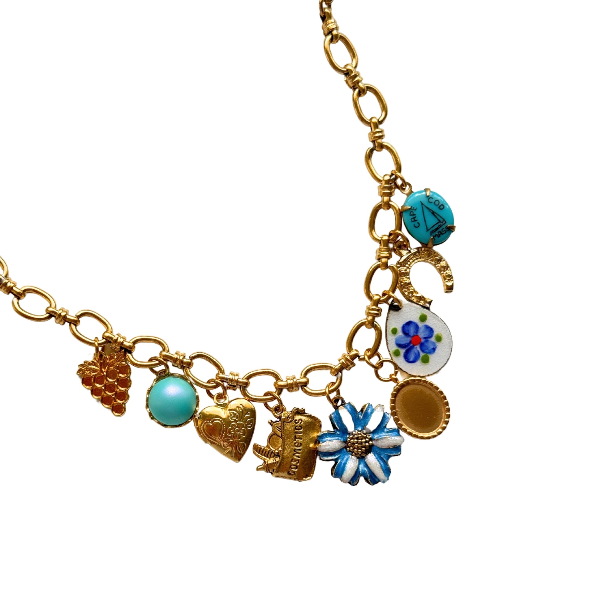 Kyra Bracelet flatlay with gold and blue floral charms