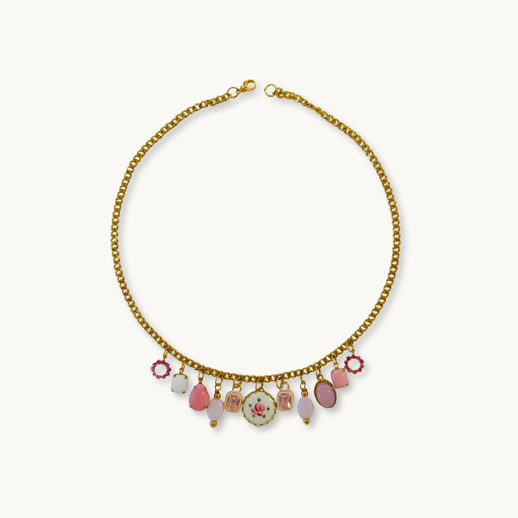 Layla Necklace featuring an Amour medium chain with 11 vintage-inspired charms in soft pink hues
