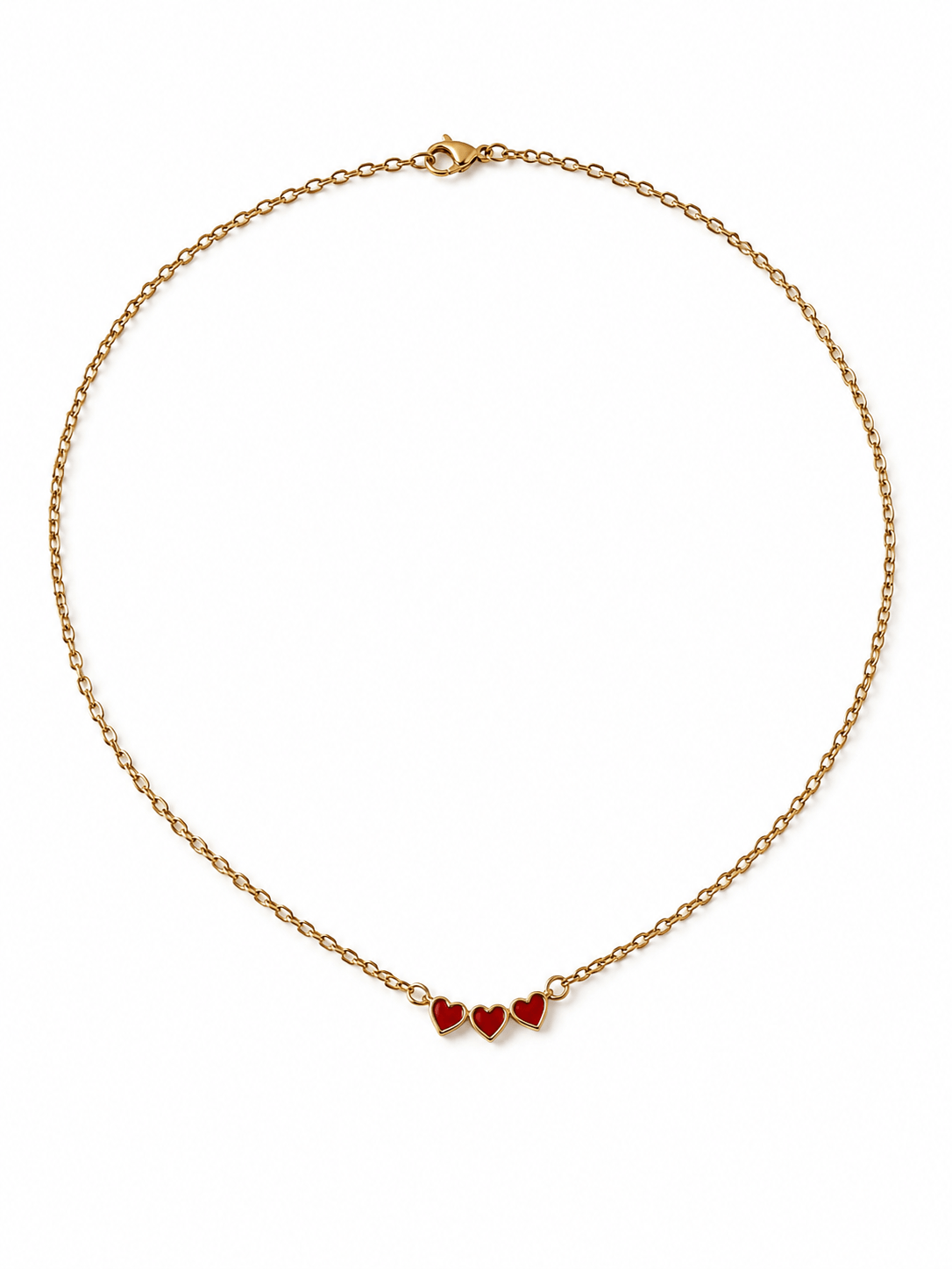 A delicate gold chain necklace featuring three small red heart charms in graduated sizes, displayed on a clean white background.
