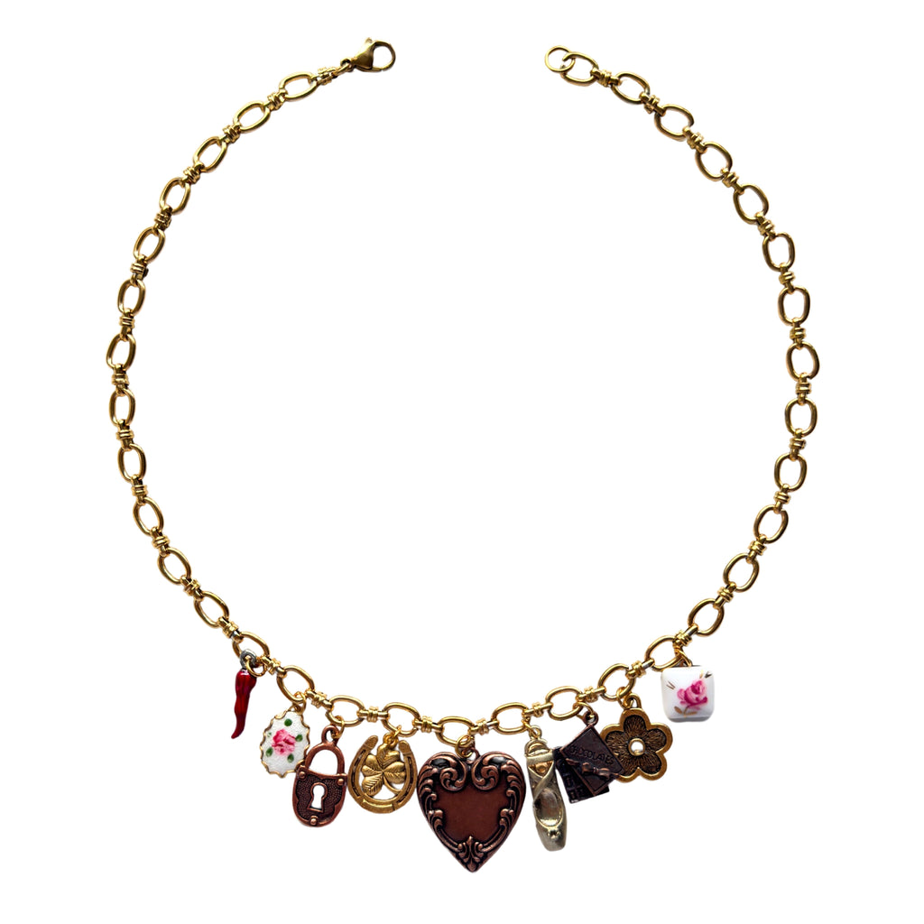Lisa Necklace flatlay with lucky and vintage-inspired charms