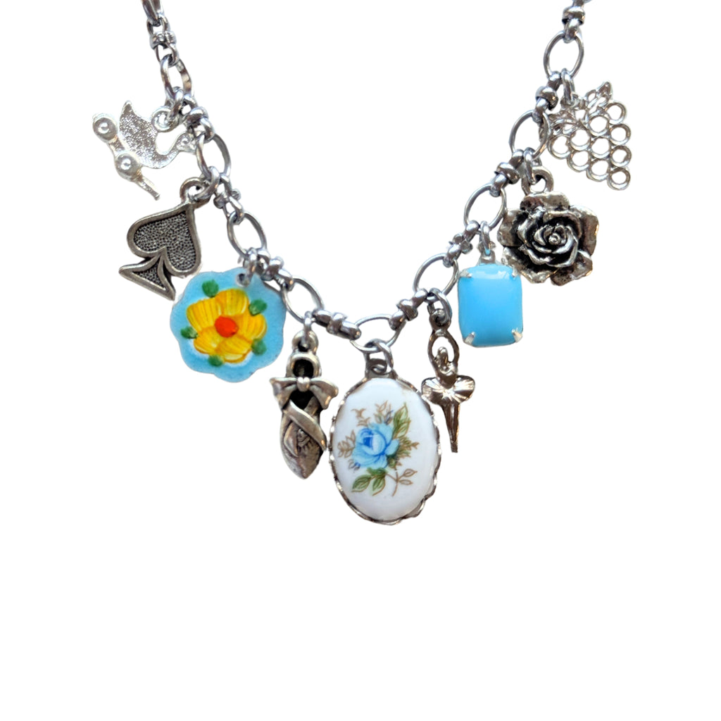 Close-up of yellow flower guilloche and ceramic rose cabochon