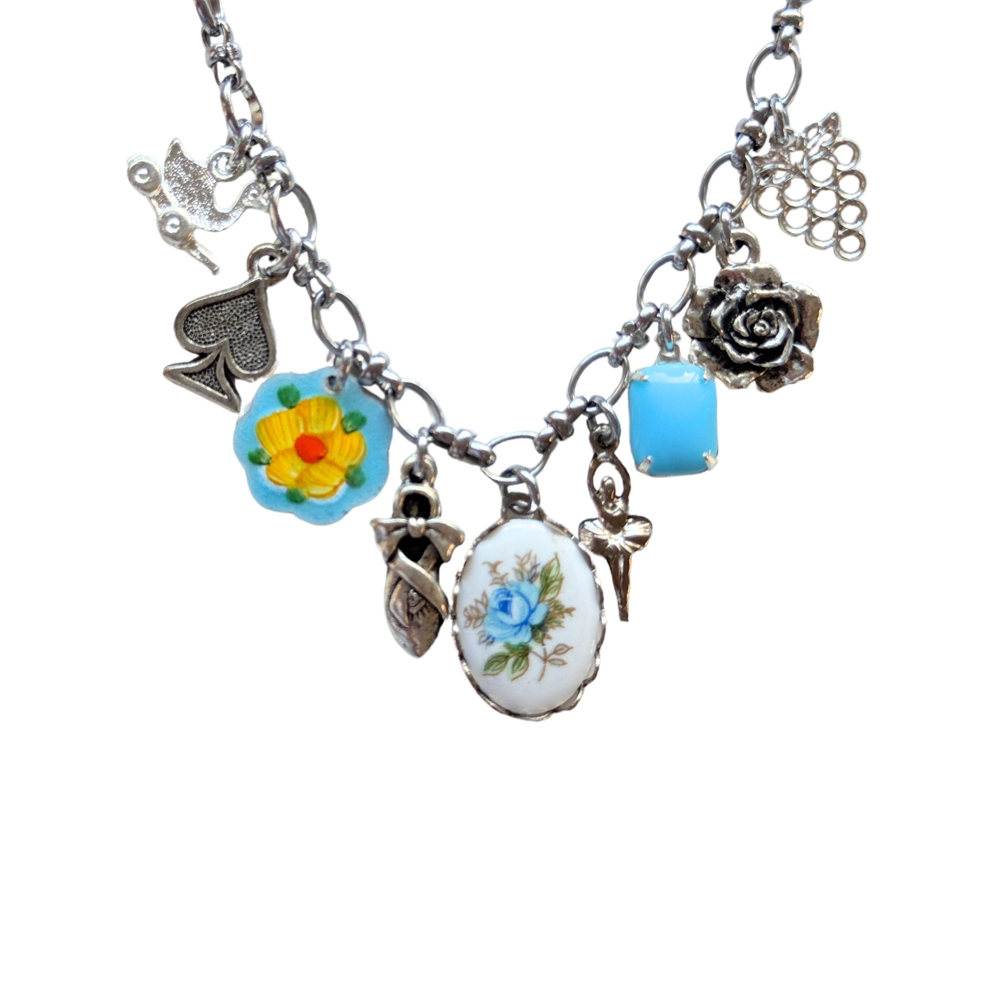 Close-up of yellow flower guilloche and ceramic rose cabochon