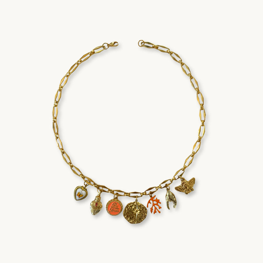 Flat-lay of the Lyn Necklace against a neutral background for a classic look.