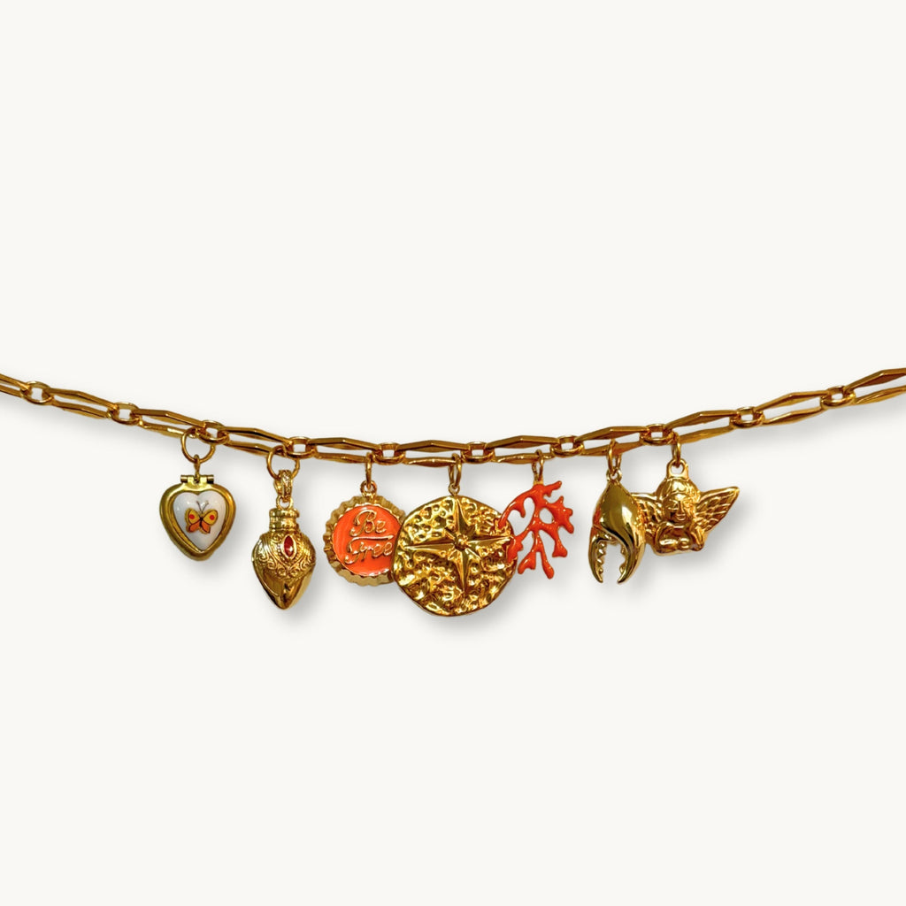 Close-up of the Lyn Necklace featuring a mix of vintage and modern charms.