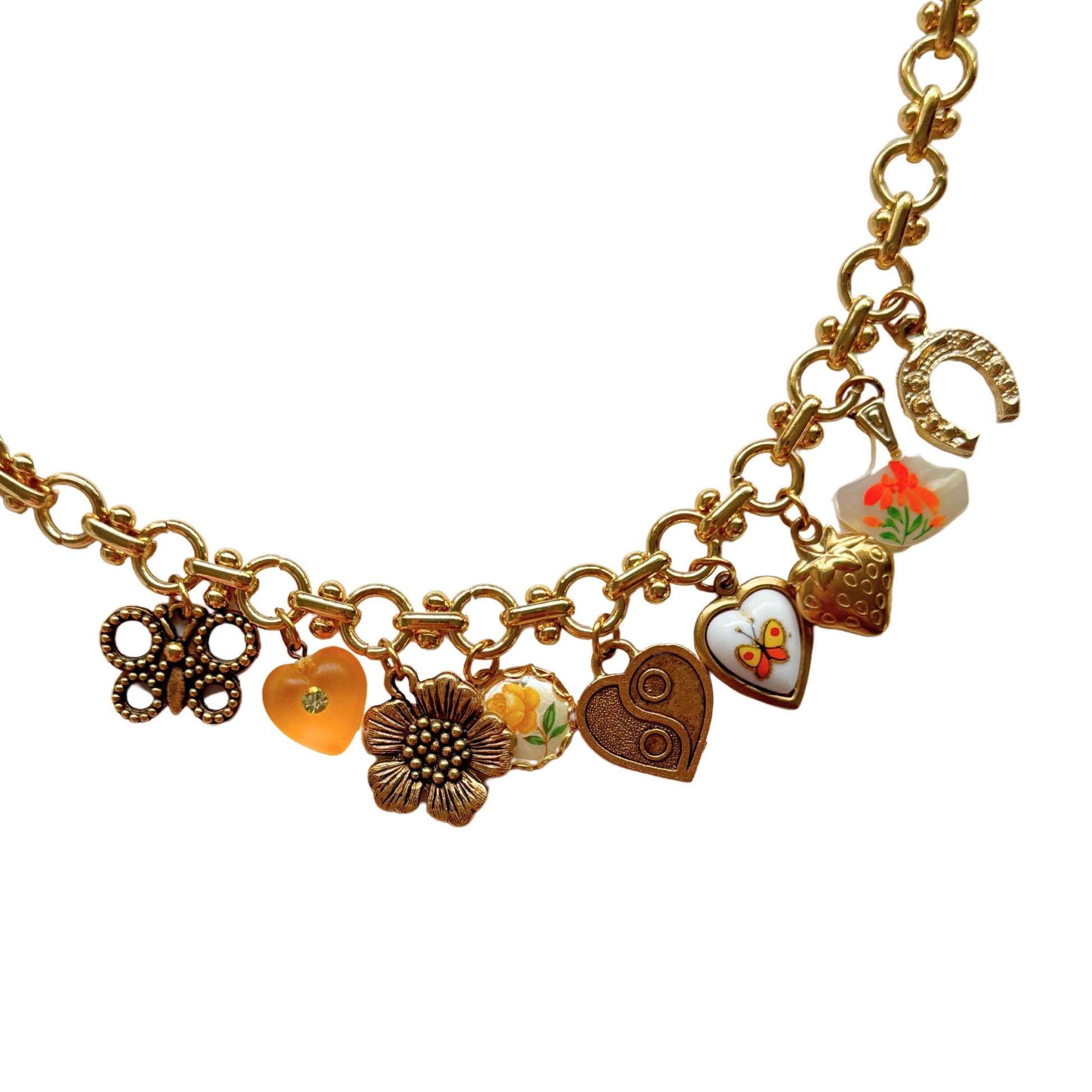 Vintage-inspired bracelet with ceramic orange butterfly heart and dainty flower charms