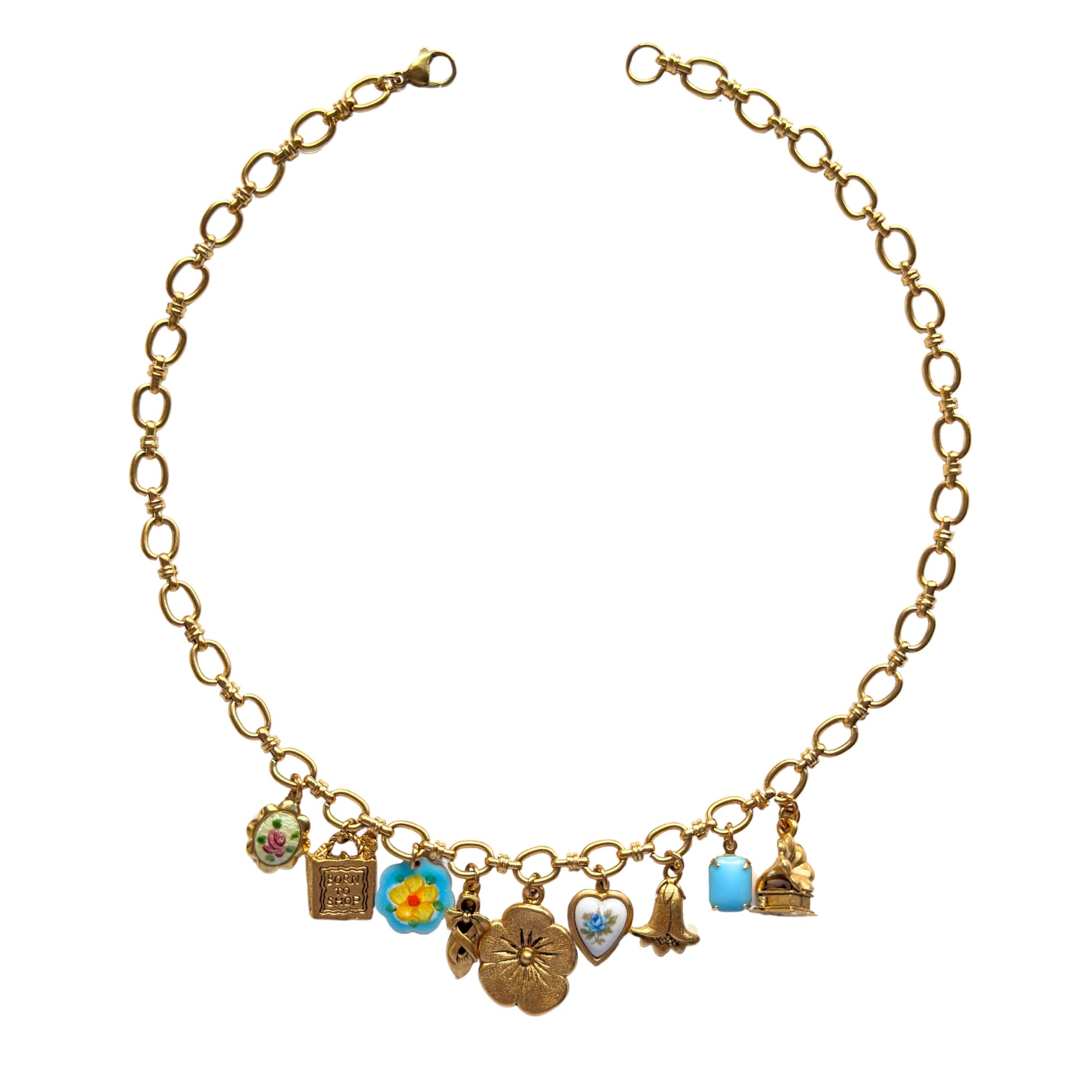 Manon Necklace flatlay with vintage-inspired charms