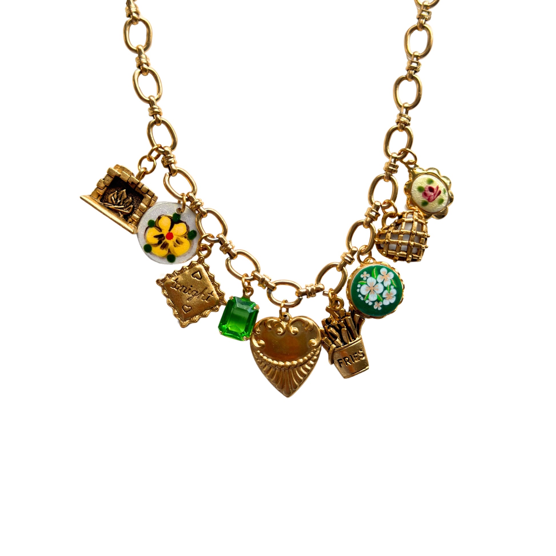 Close-up of fireplace, pillow, and trellis heart gold charms


