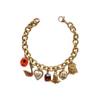 Chunky charm bracelet with hand-painted details and bold gold chain