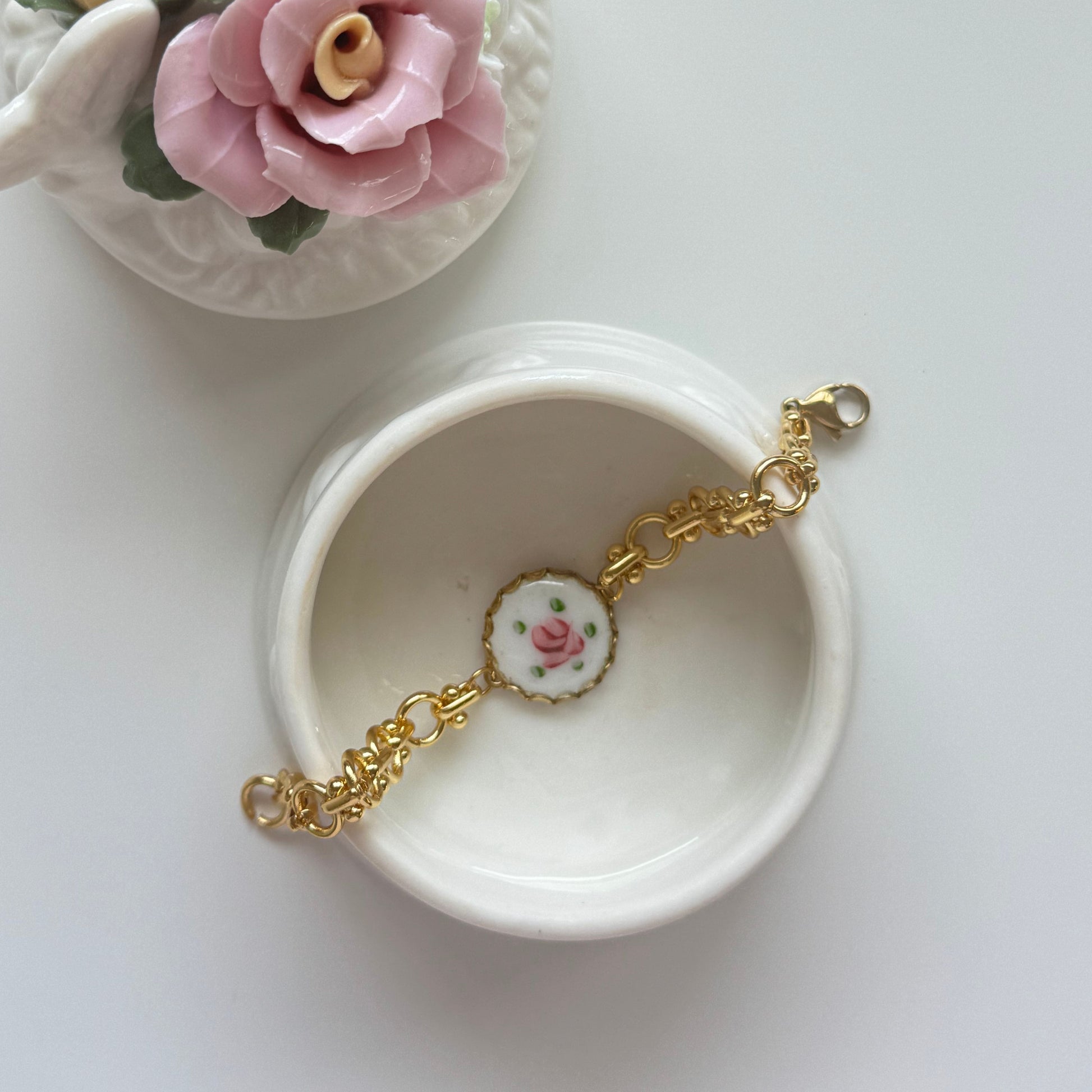 Feminine handmade bracelet with delicate chain and rose medallion centerpiece