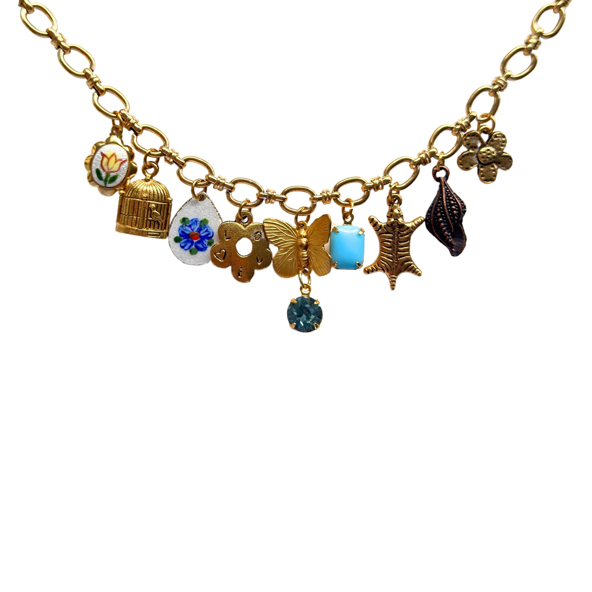 Close-up of blue flower guilloche and rhinestone drop